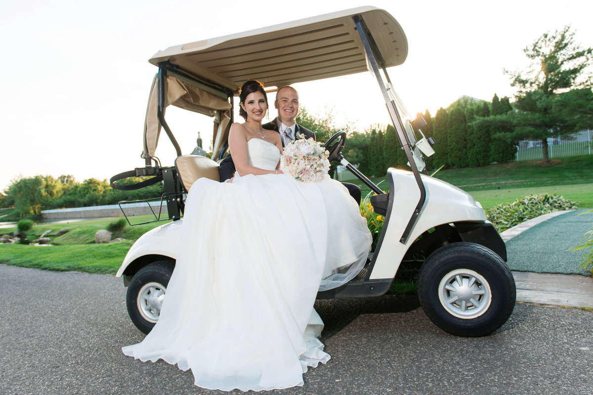 bride and groom on golf cart outside Willow Creek Golf and Country Club