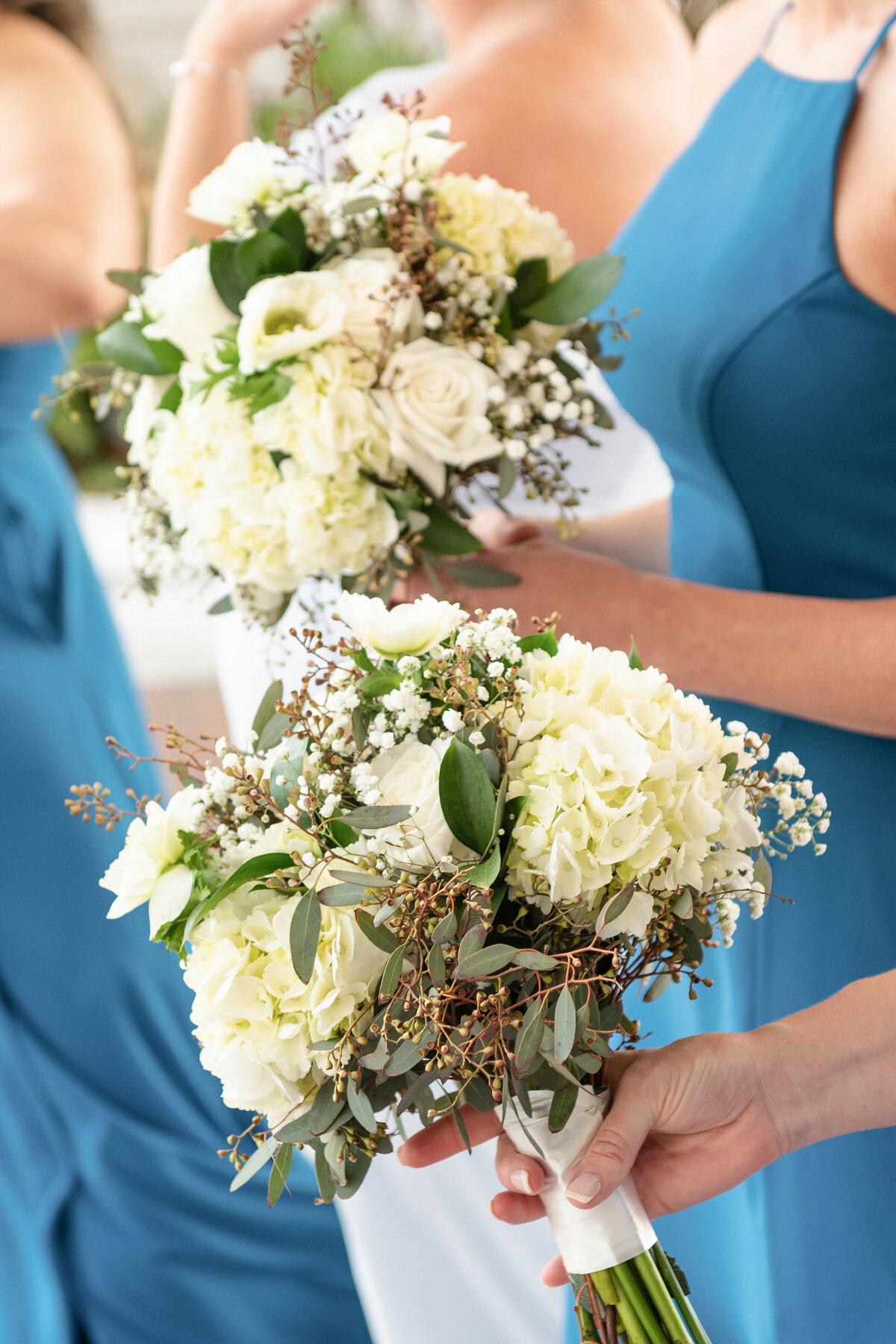 Bridesmaids holding bridal bouquets