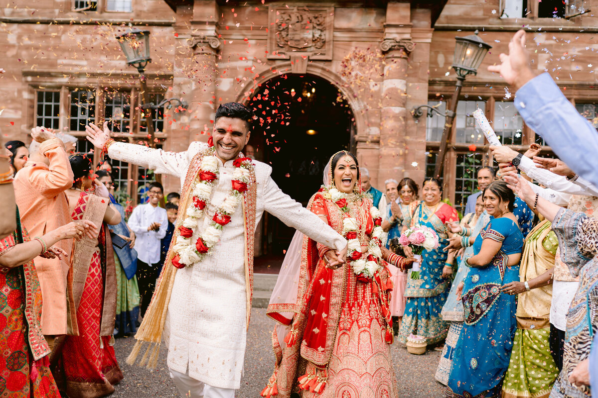 indian wedding photo of confetti being thrown at wrenbury hall