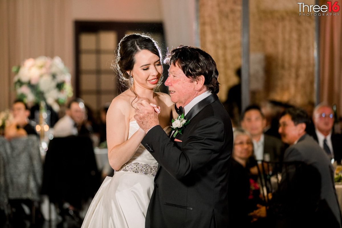 Bride dances with her father at her wedding