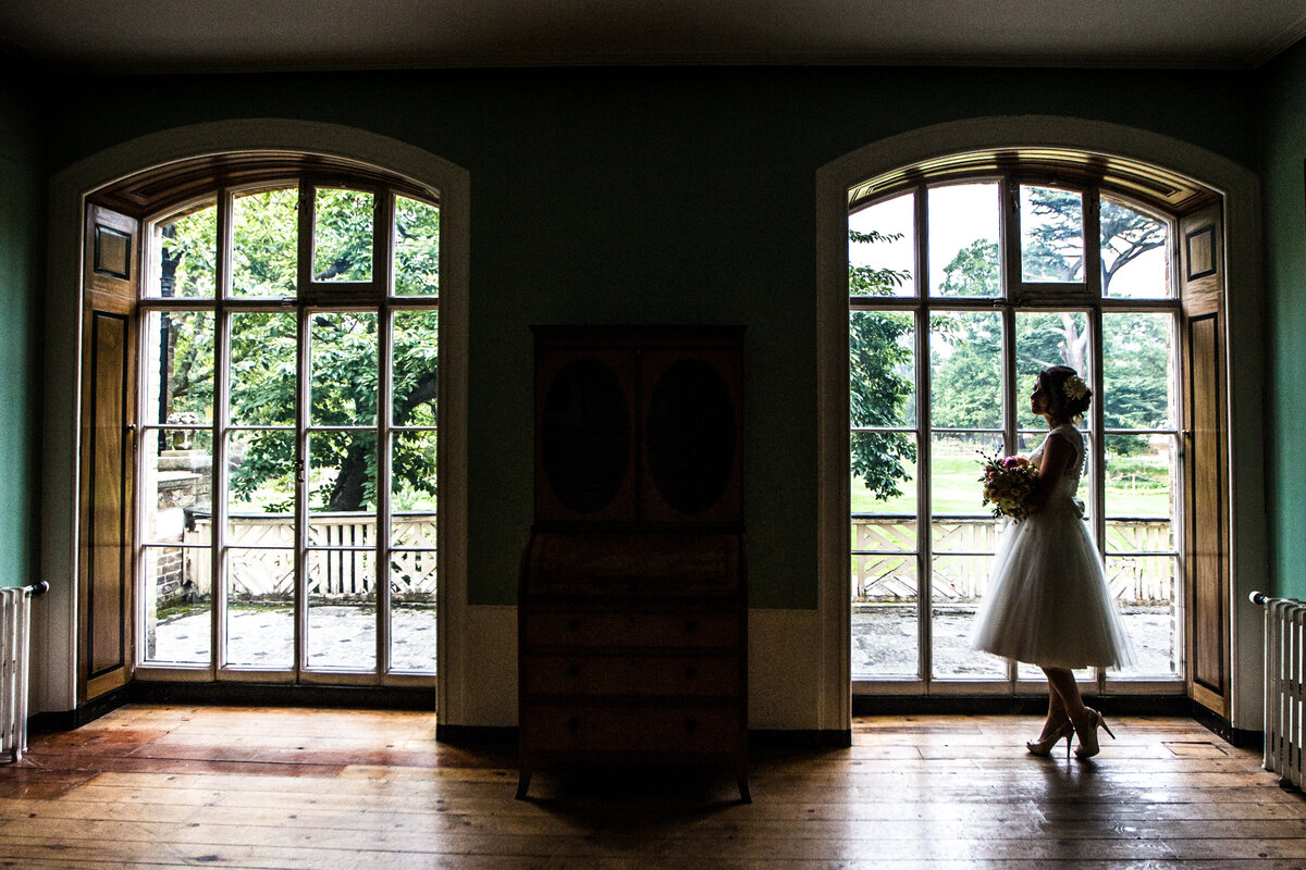 Bridal portrait in front of glass windows
