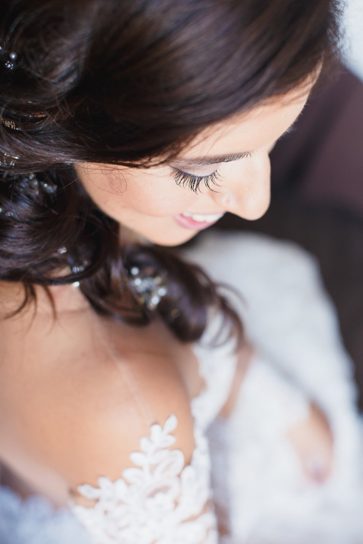 Above Close Up View of Bride at One Ocean Jacksonville Beach Wedding Looks Down While Smiling