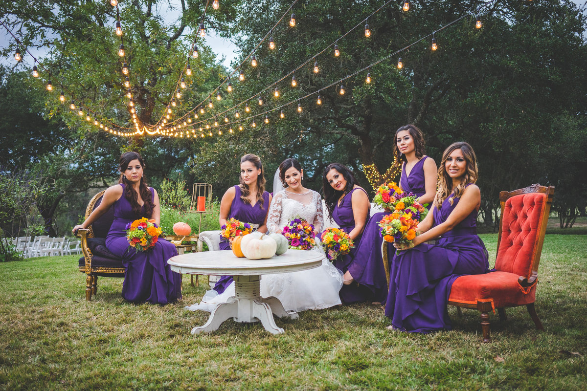 Bridal party sitting on vintage chairs at the Marquardt Ranch by San Antonio Wedding photographer Expose The Heart