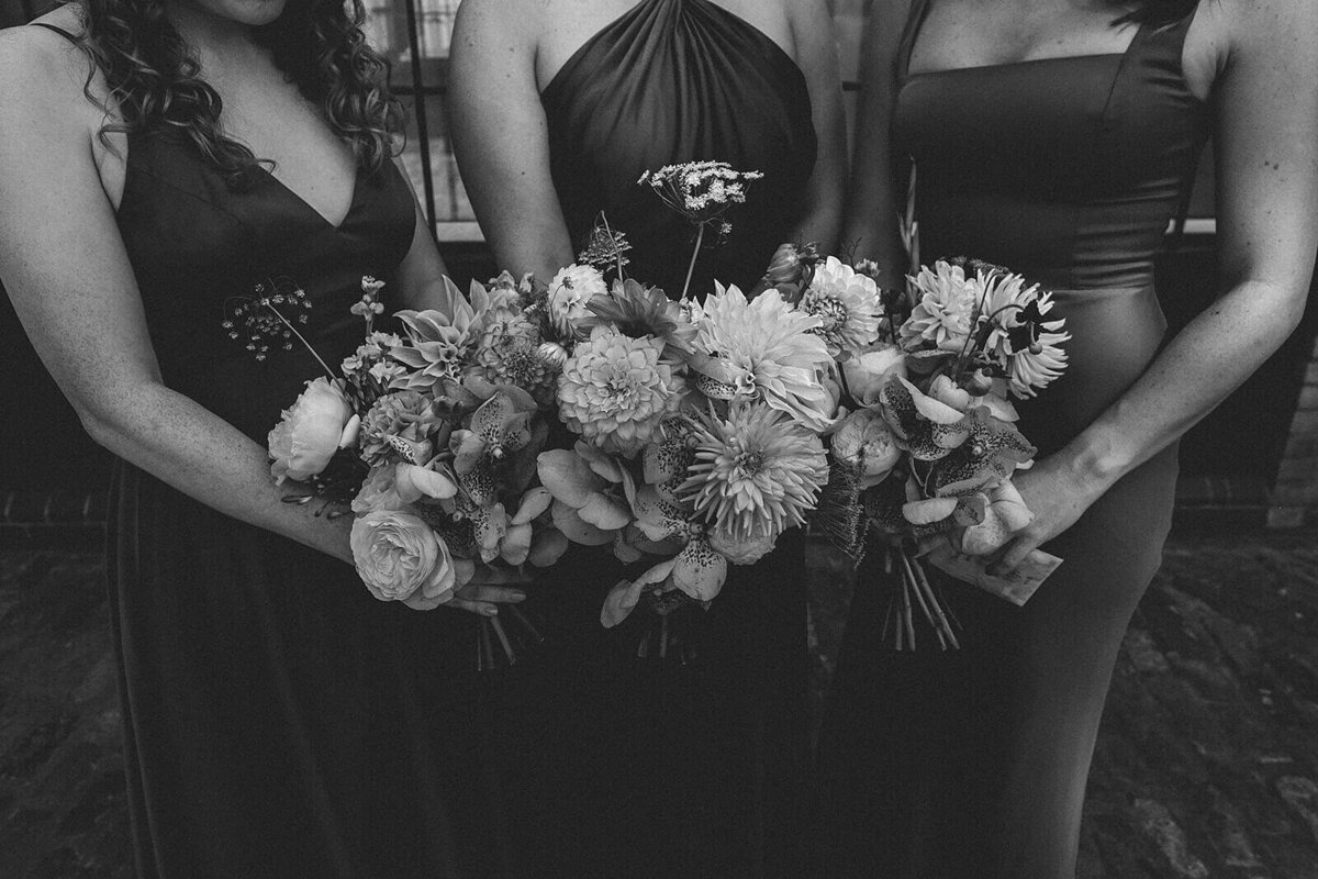 bridesmaids holding wedding flowers
