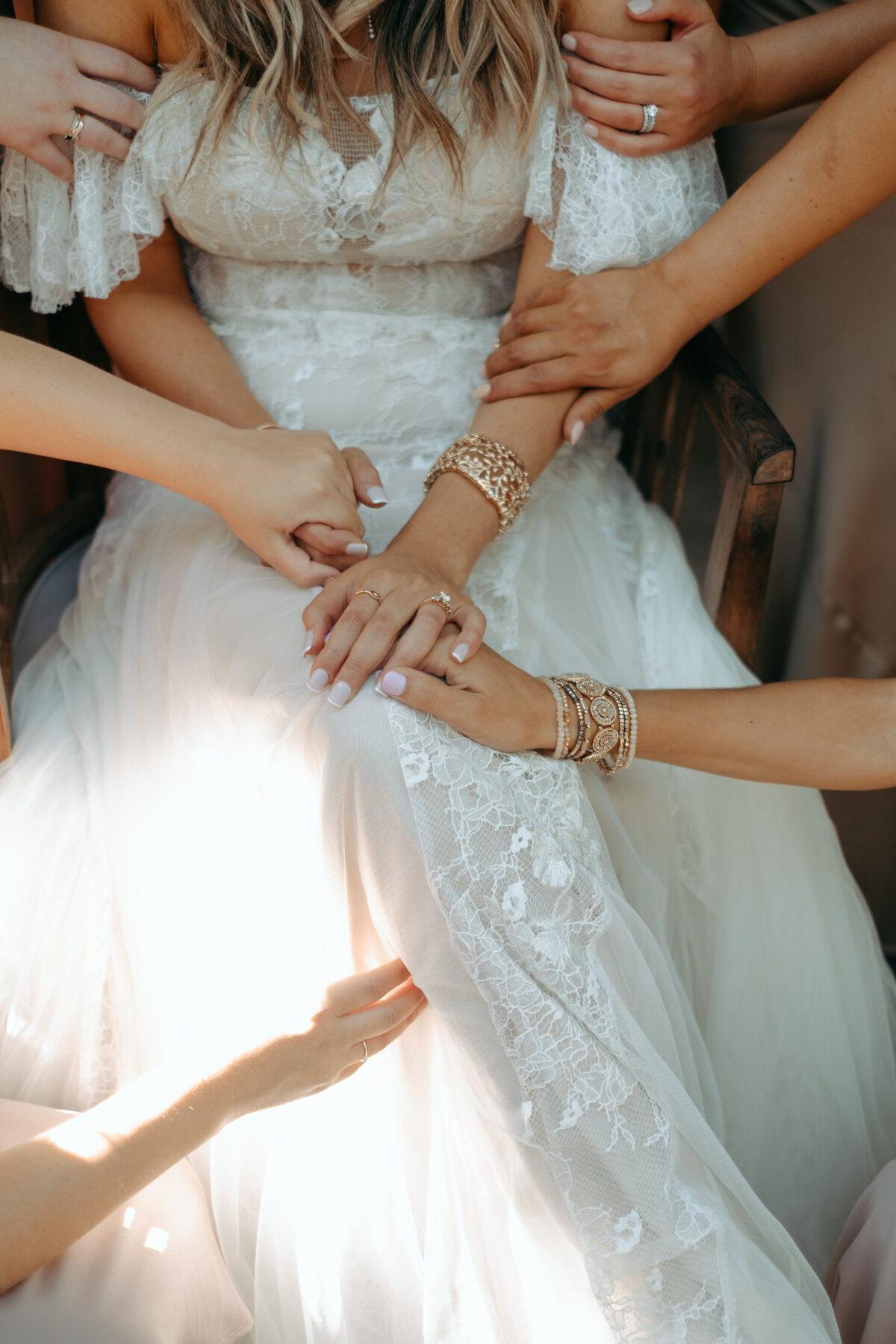 Bridesmaids holding bride in prayer St Catherine of Siena Wedding  | The Axmanns