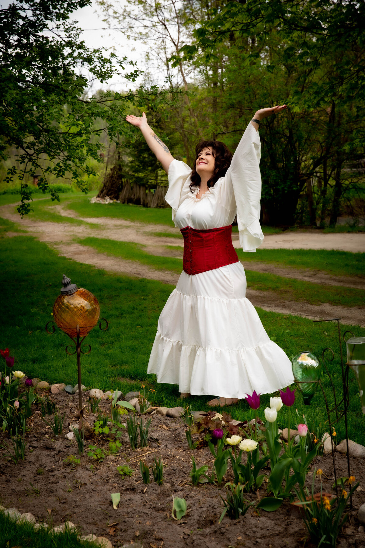 goddess studio woman rejoicing sing praise red waist corset wiccan pagan