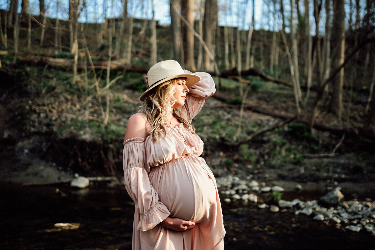 Pregnant woman wearing a hat