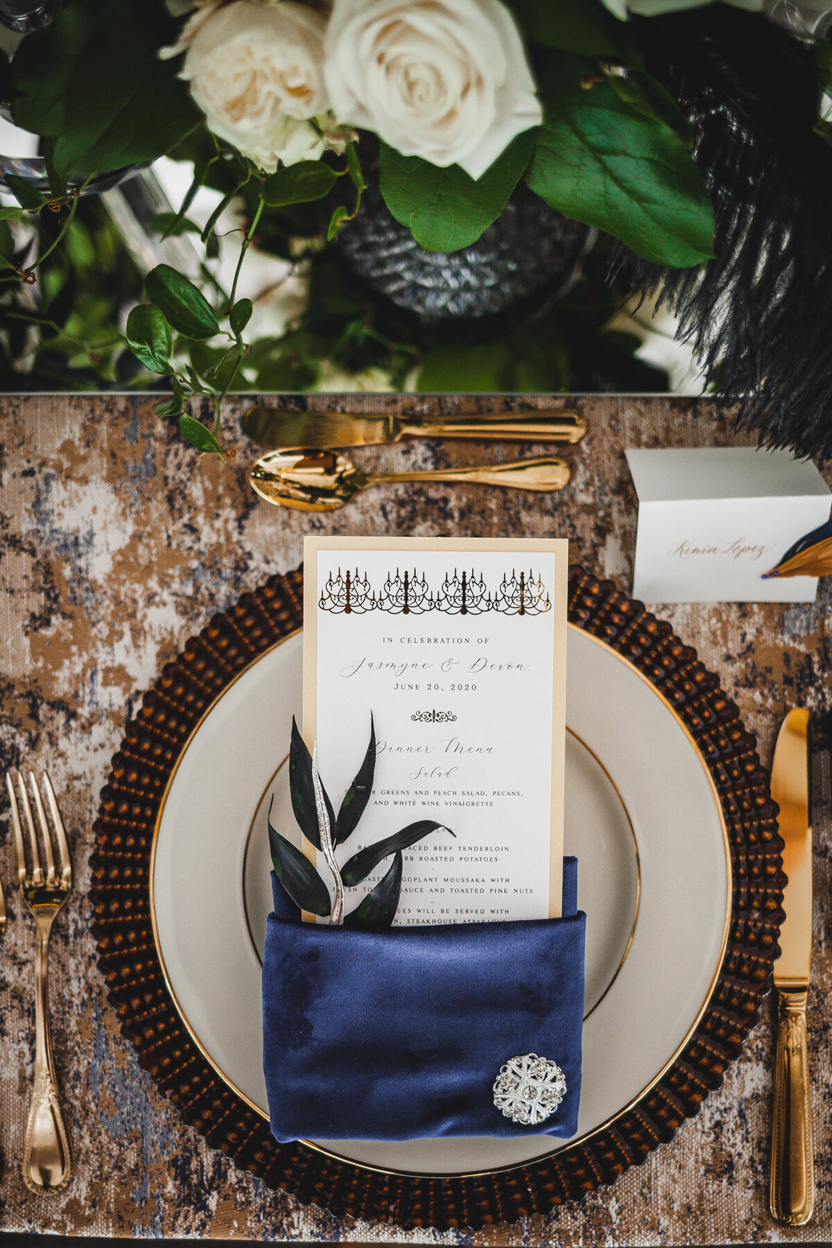 Wedding reception table with dinnerwares and menu details