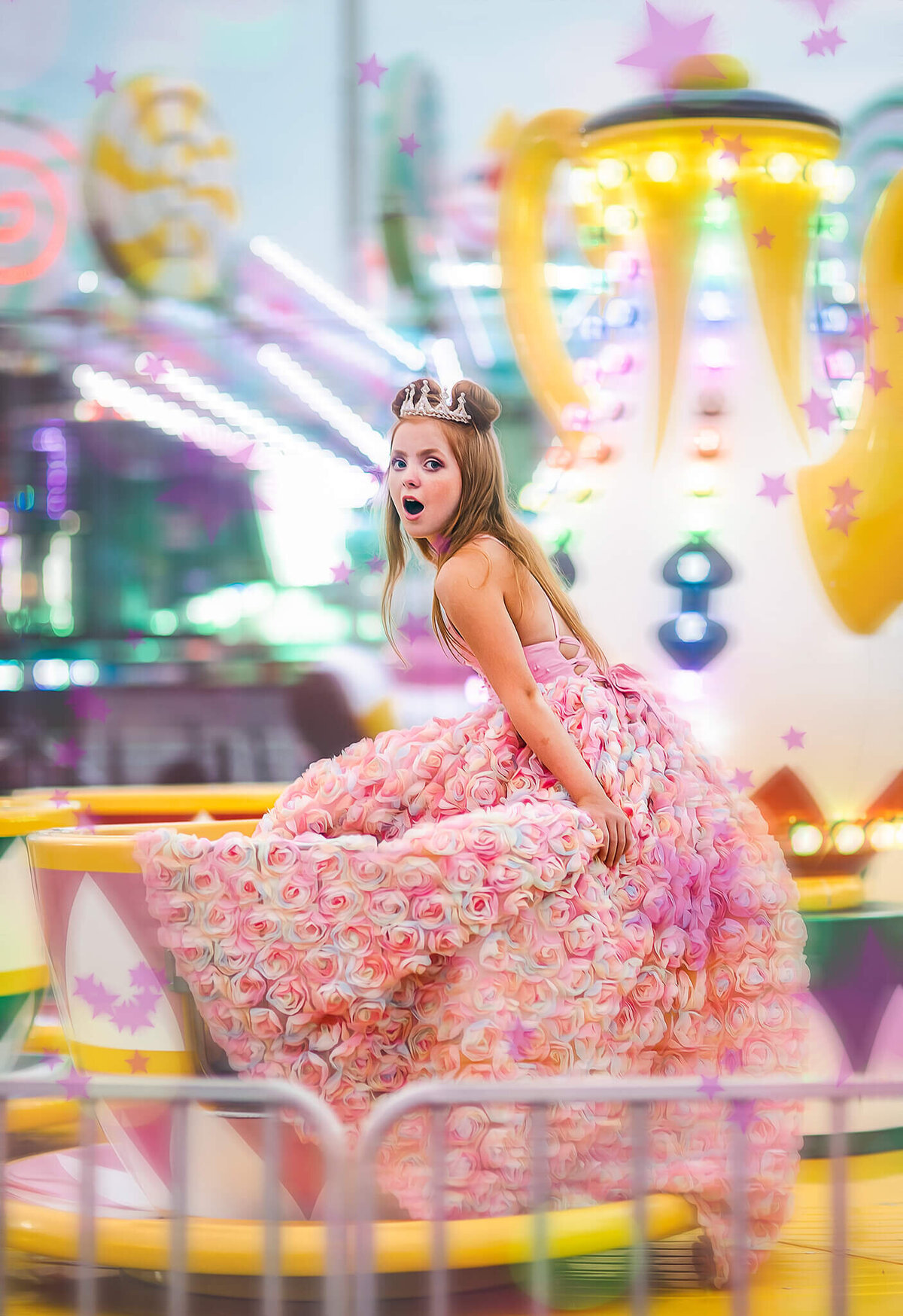 red haired girl in a pink rainbow dress spinning in a teacup at a carnival near Annapolis Maryland
