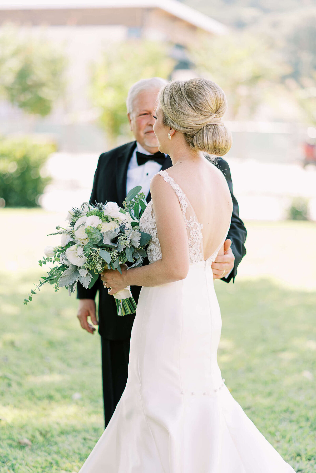 Bride and her father talk before walking down the aisle
