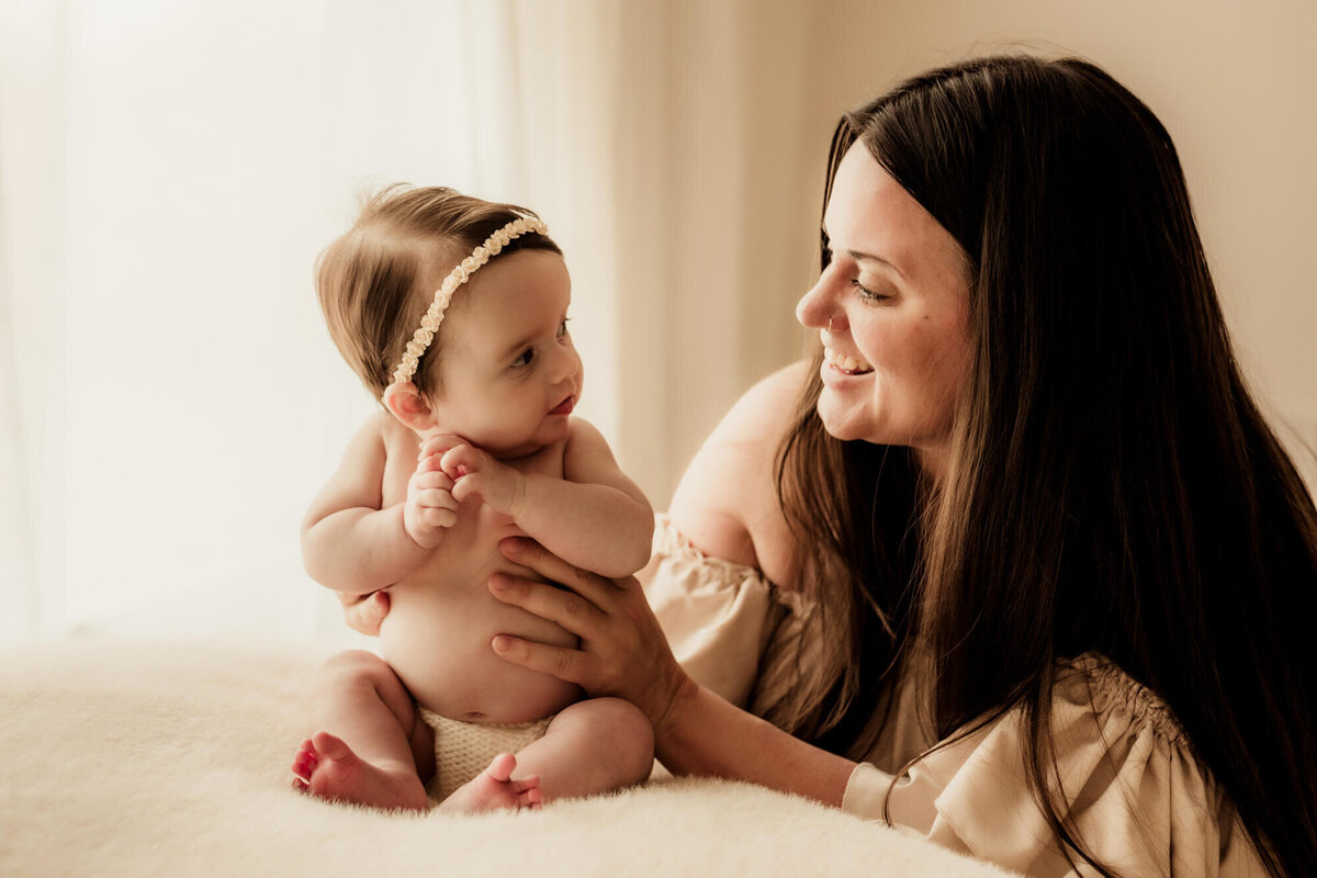 Mother and daughter look at one antoher.