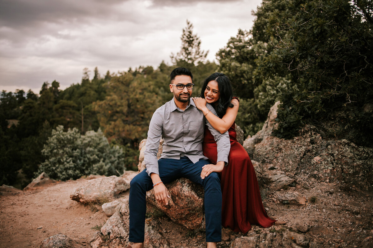 colorado couple stand on top of rocky mountain at mt falcon colorado for couples session