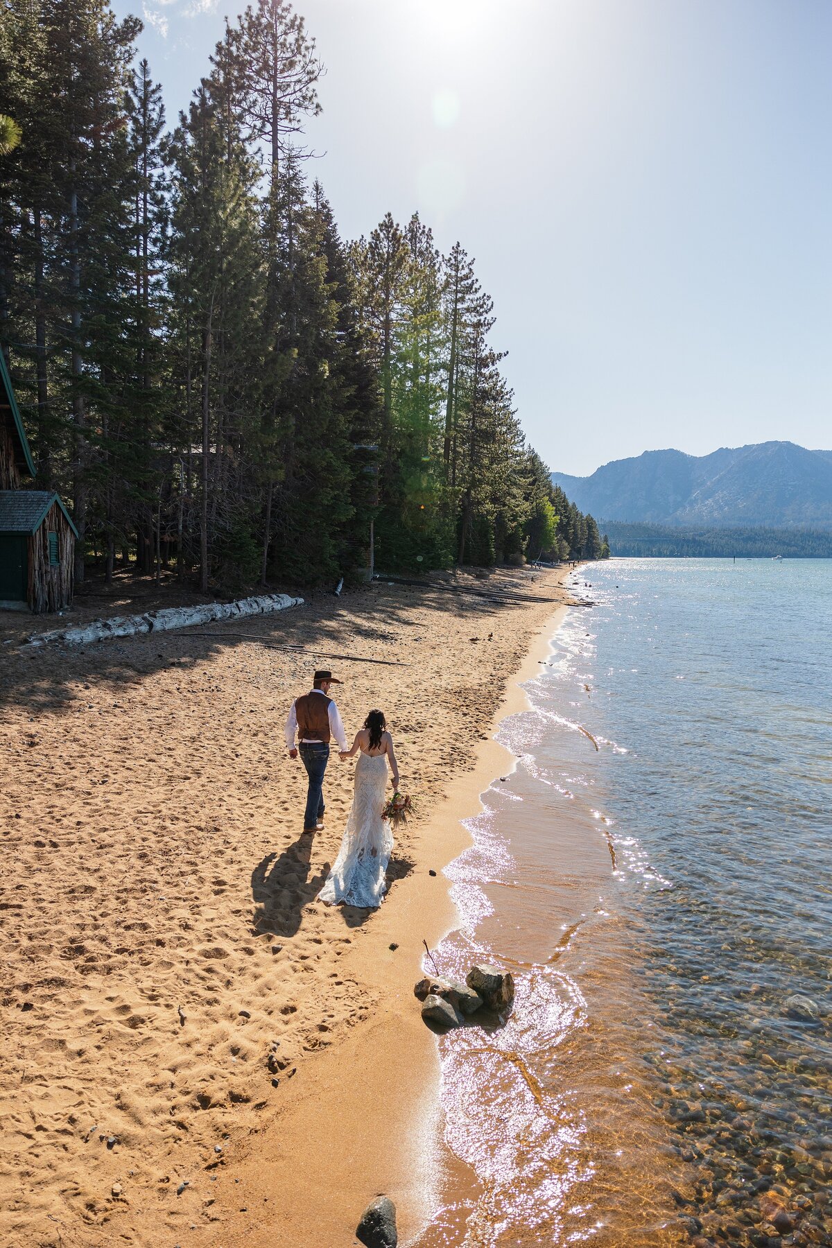 Couple walking along the lake shore