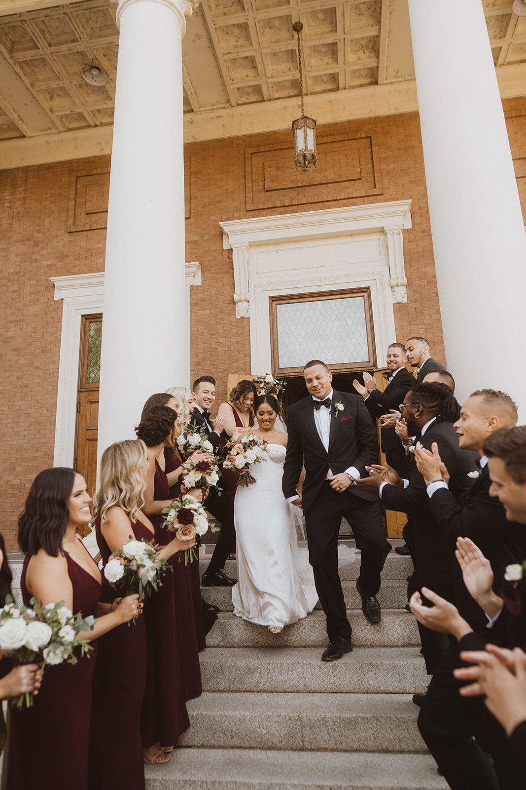 pnw wedding gallery photo of newlyweds on the steps of the st. aloysius church at Gonzaga university