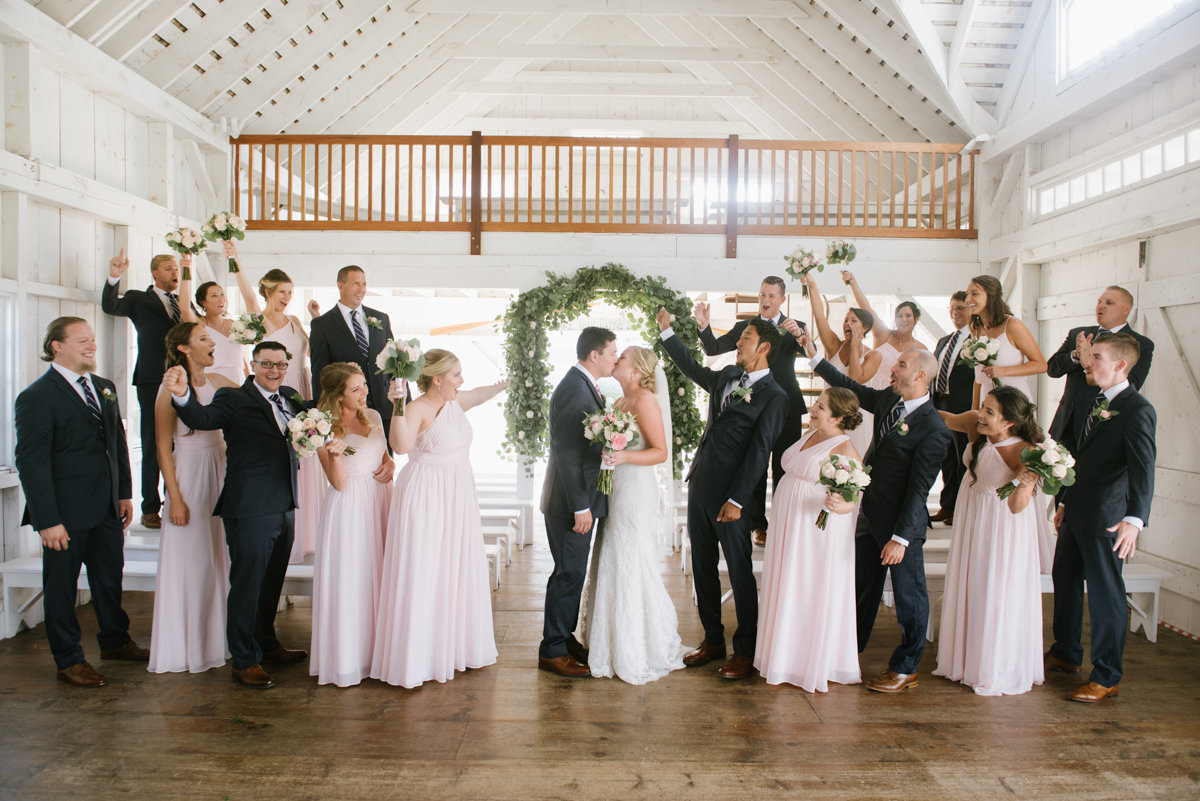 bridal party wearing blush and blue in the chapel at bonnet Island Estate