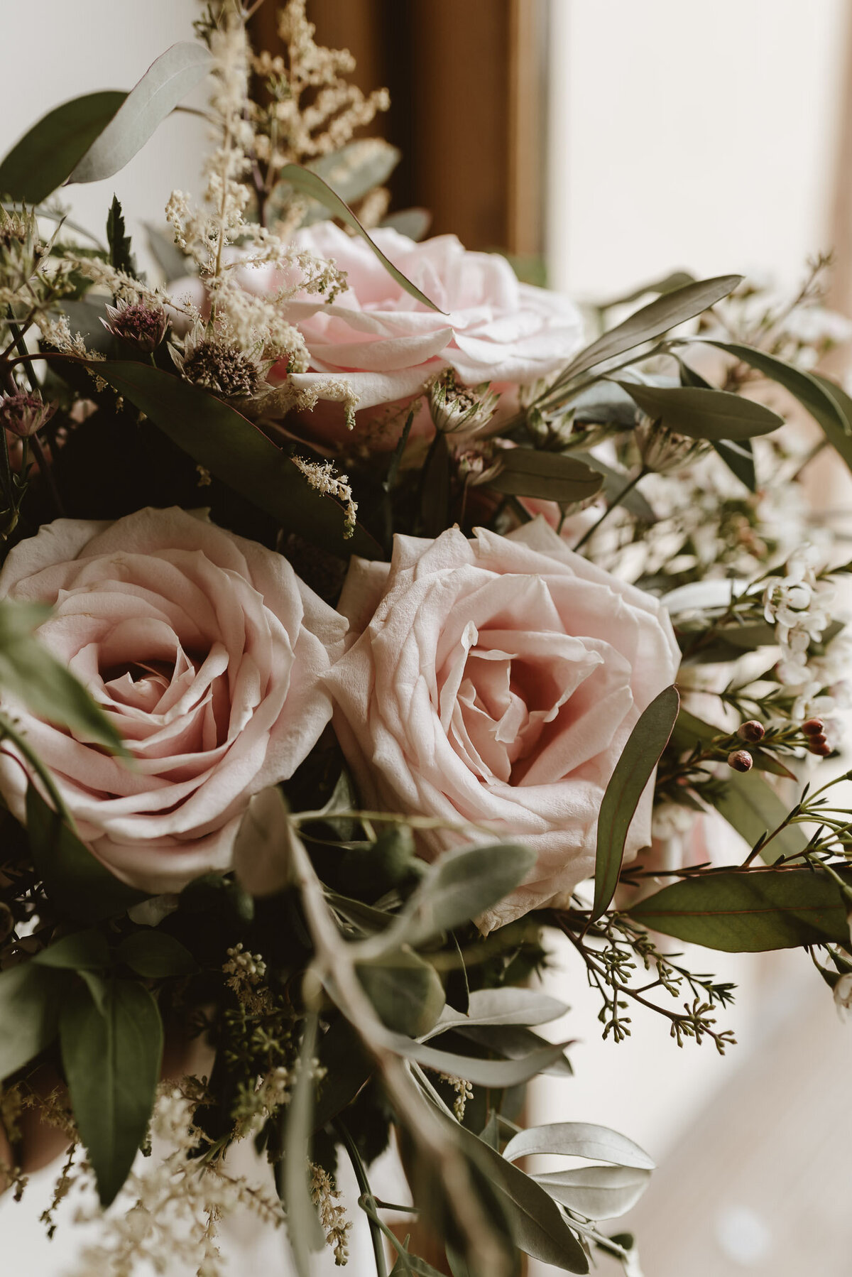 pink flowers with green foliage bouquet