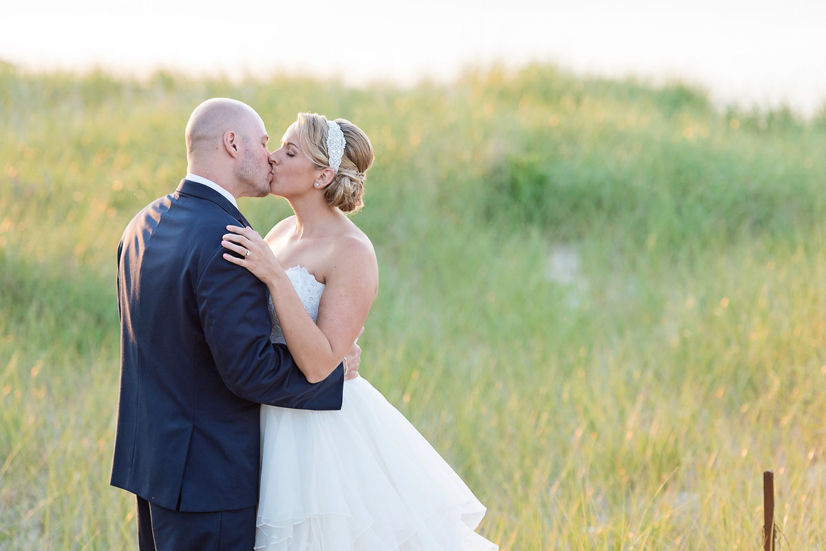 photo of bride and groom kissing at Pavilion at Sunken Meadow wedding