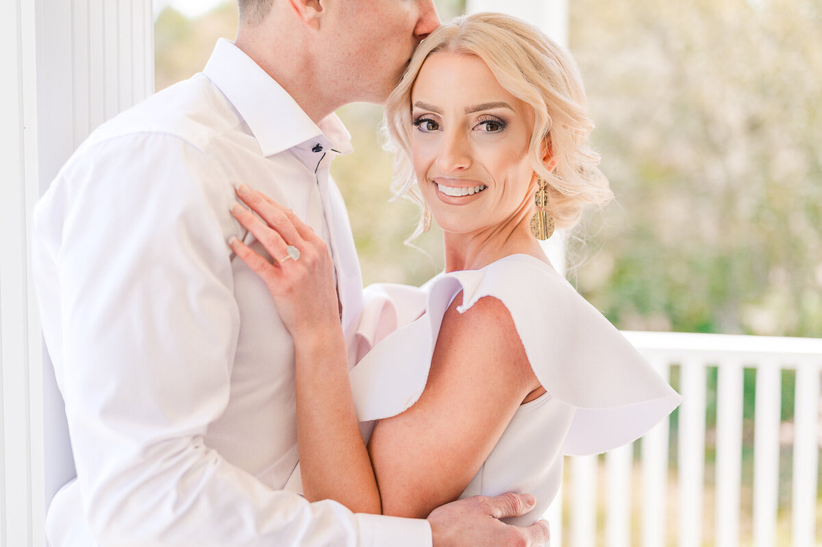 A loving engaged couple chest to chest at a Raleigh timeless home by JoLynn Photography, a North Carolina wedding photographer