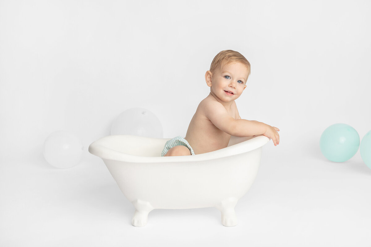 Rub a dub dub, there's a baby boy in the tub. Milestone portrait session captured by Karen Kahn