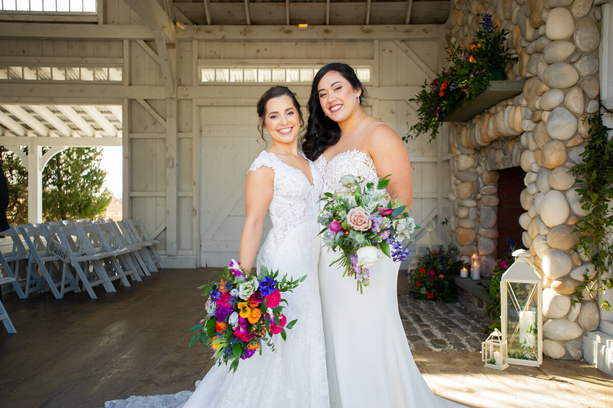 boathouse chapel with lesbian brides and colorful flowers