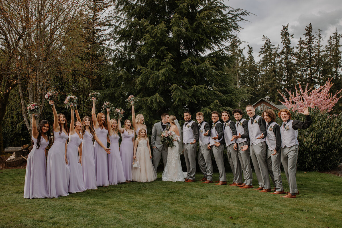 Bridesmaids and groomsmen lined up with bride and groom
