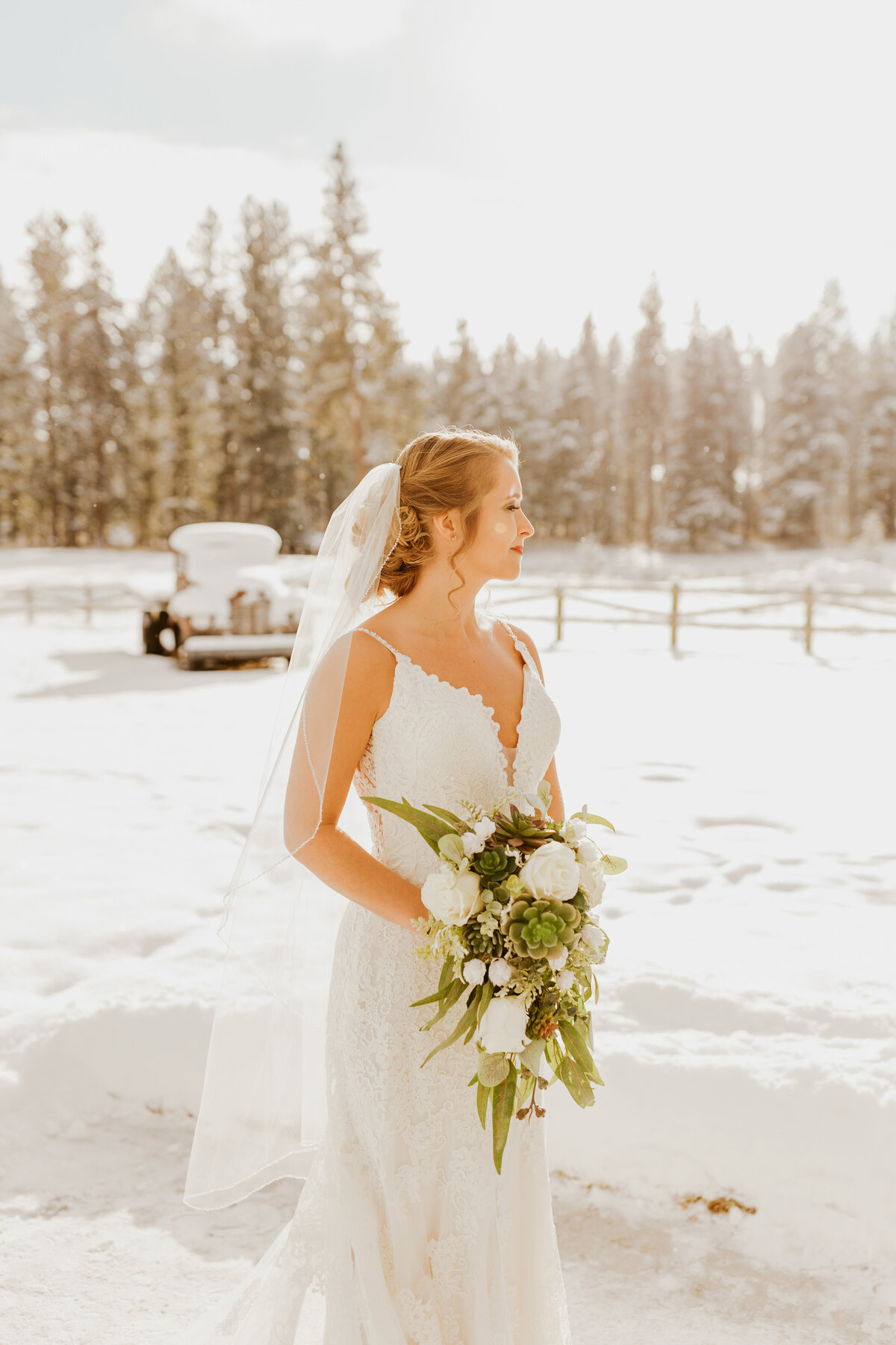 bride posing in snow