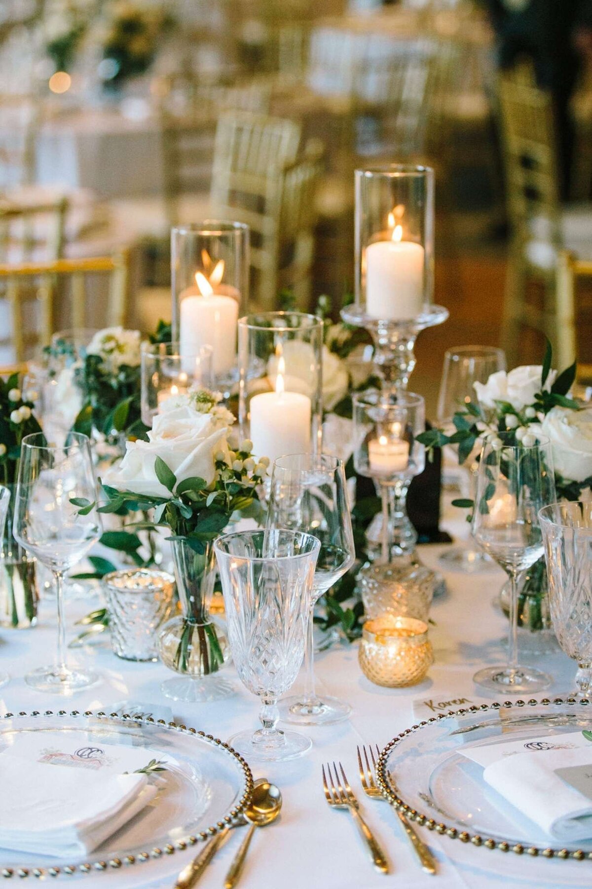 Classic and Elegant Placesetting with Gold Flat ware and Crystal Stemware for a Luxury Michigan Lakefront Golf Club Wedding.