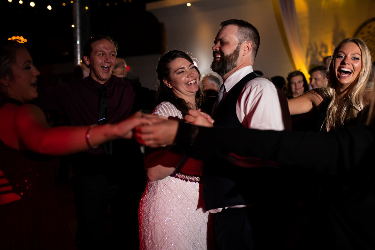 Bride and groom are joined by their guests during first dance