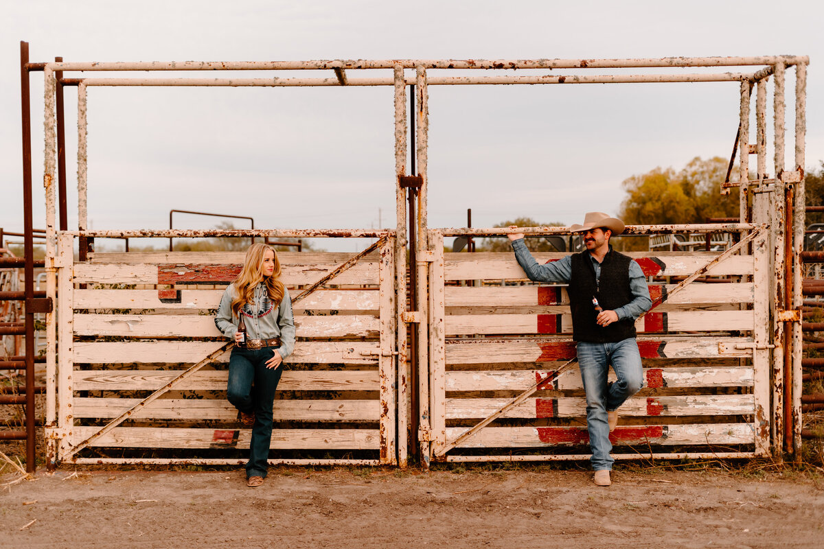 couple posing by gate