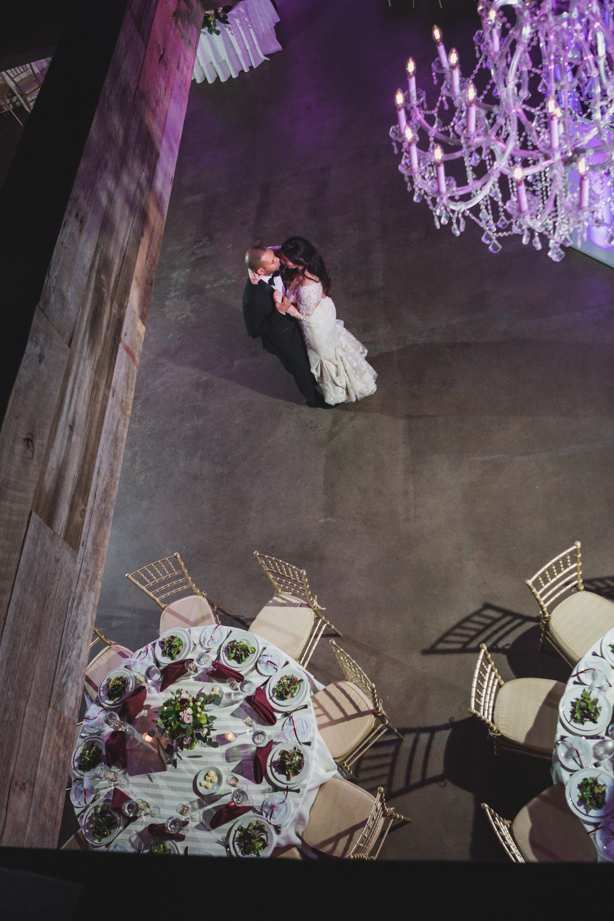 wedding photo of bride and groom dancing and holding each other during reception at The Loft by Bridgeview