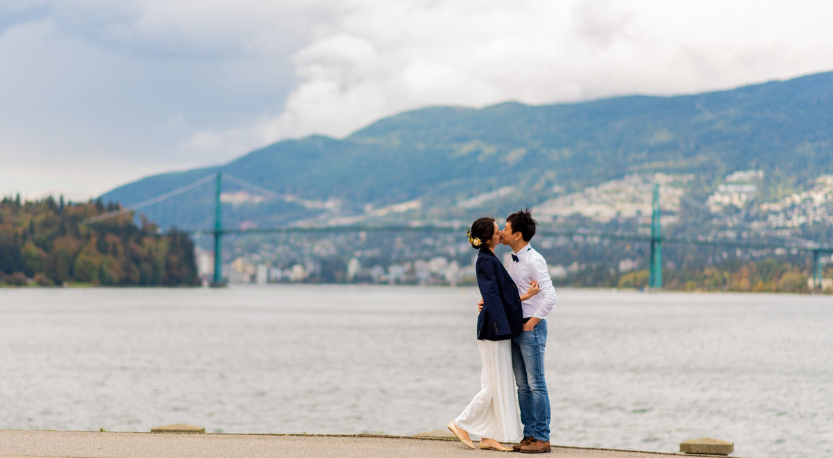 Stanley Park wedding session with Lions Gate bride in the background.