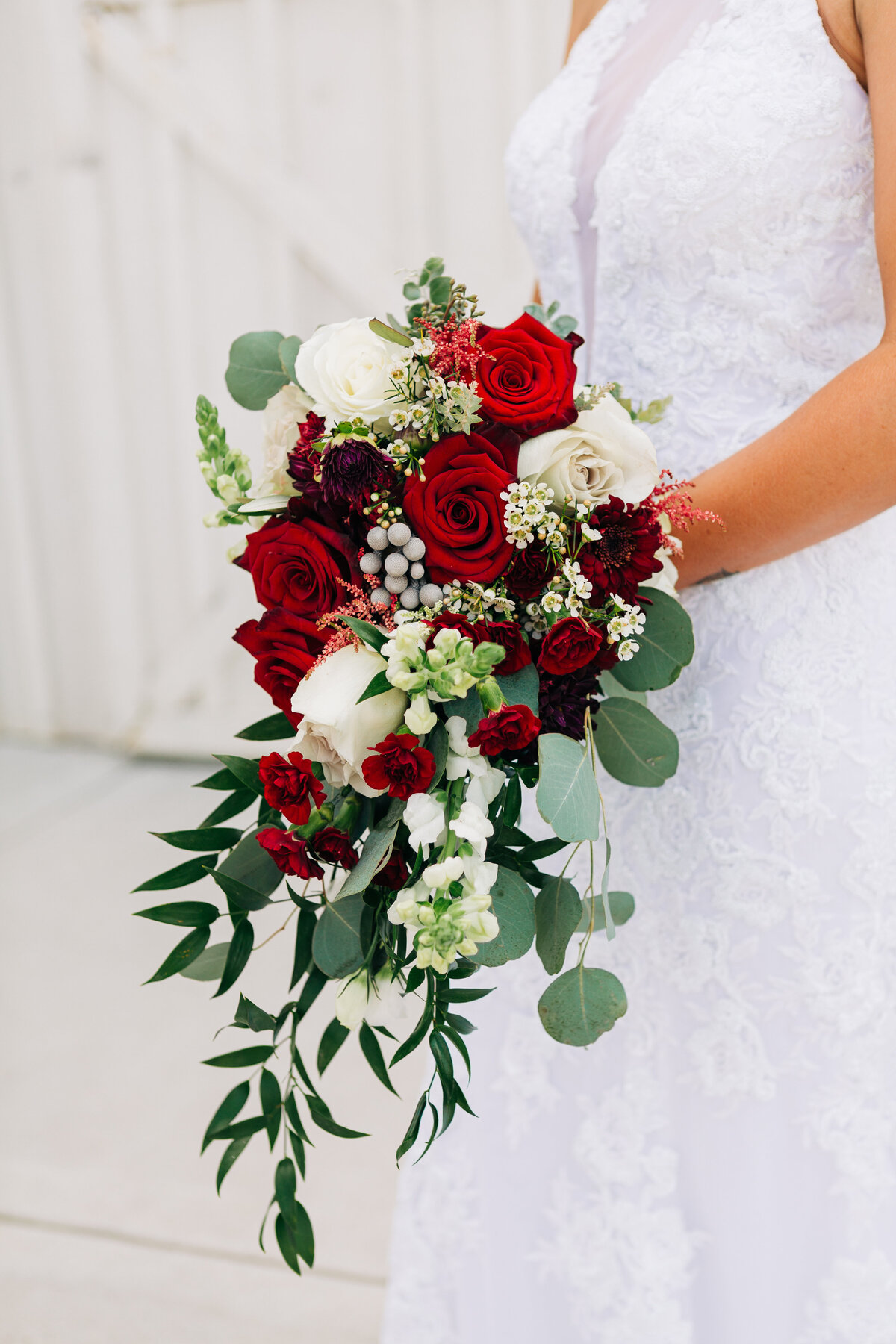Red roses in cascading bridal bouqet