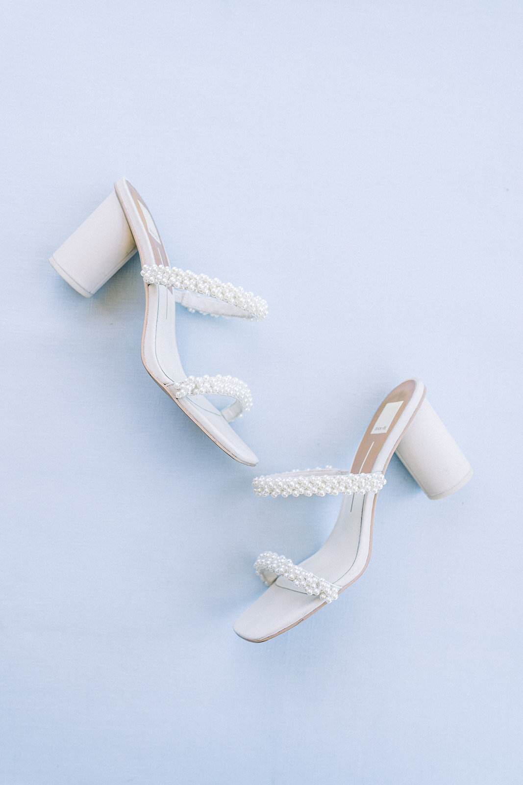 Brides wedding shoes at Dolphin Bay Resort in Pismo Beach, CA
