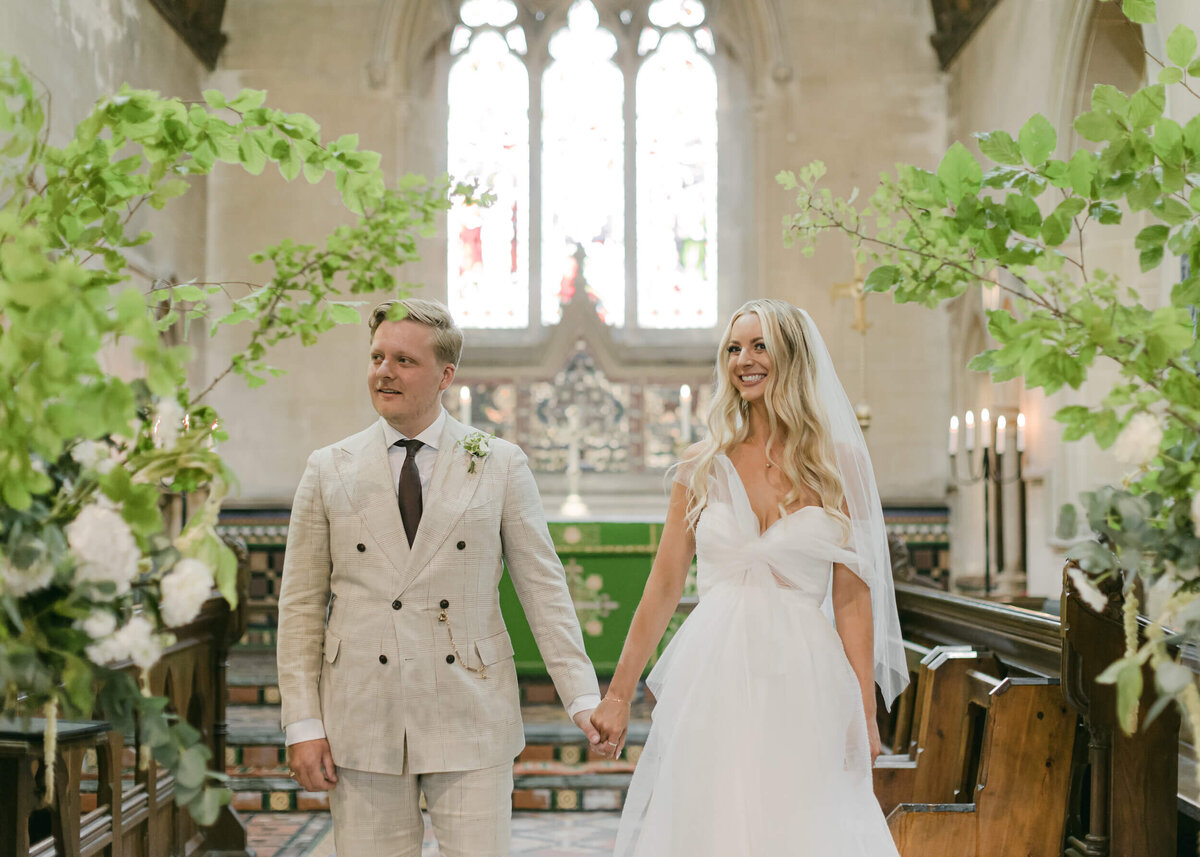 chloe-winstanley-weddings-church-ceremony-bride-groom-foliage