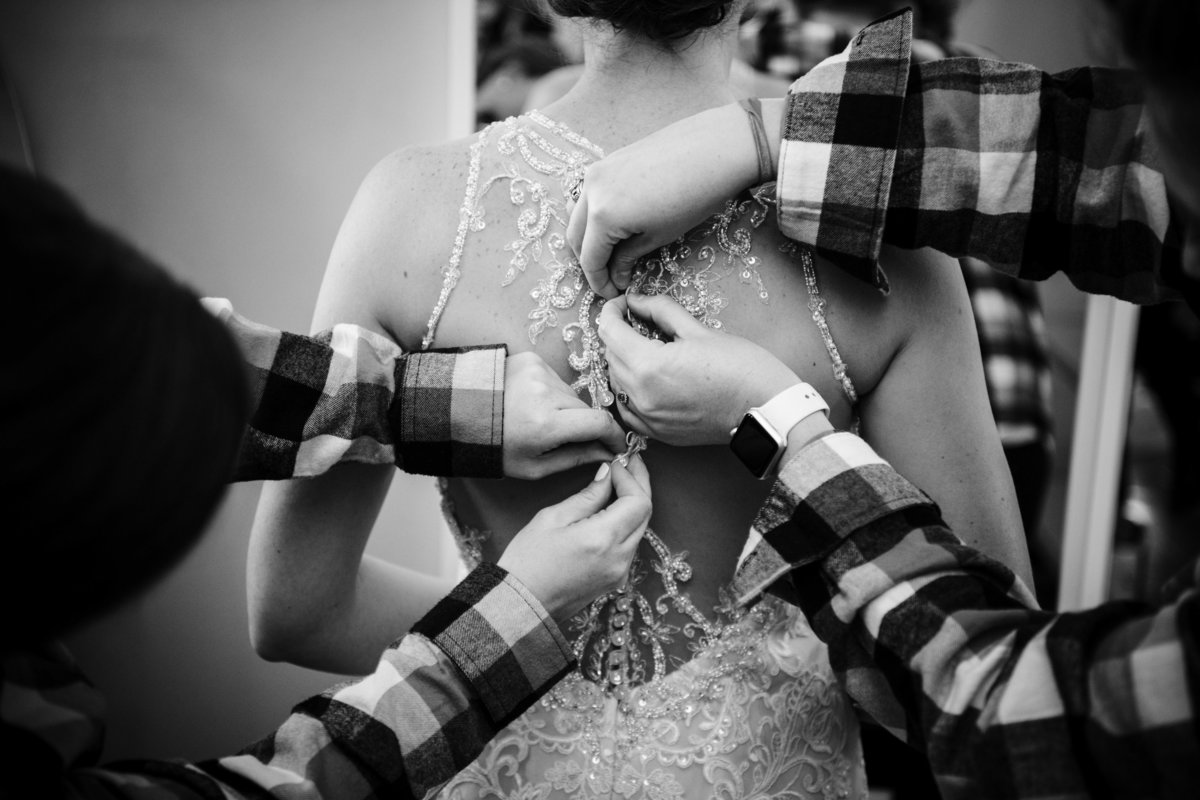 Bridesmaids in flannels button up wedding dress.