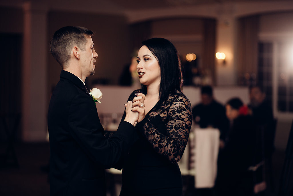 Wedding Photograph Of Man In Black Suit Dancing With a Woman In Black Dress Los Angeles