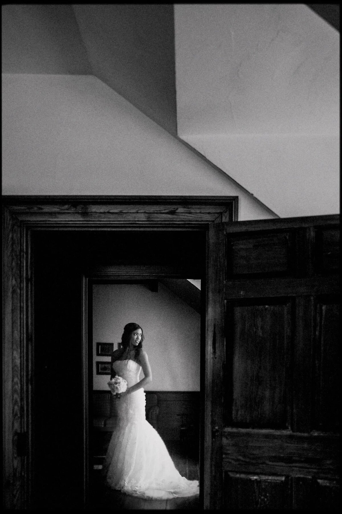 A bride through a doorway looking backwards