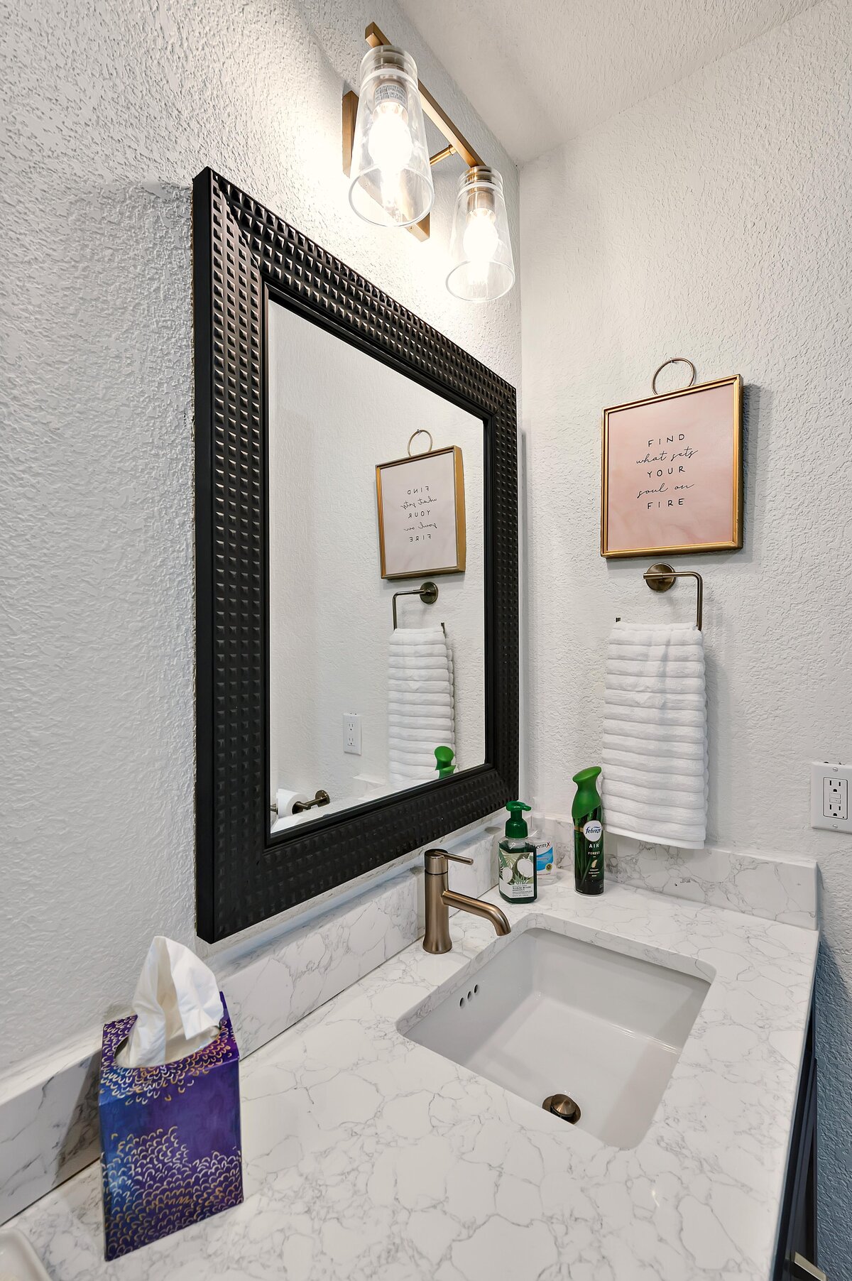 Bathroom vanity in this two-bedroom, two-bathroom vacation rental condo in the historic Behrens building in the heart of the Magnolia Silo District in downtown Waco, TX.