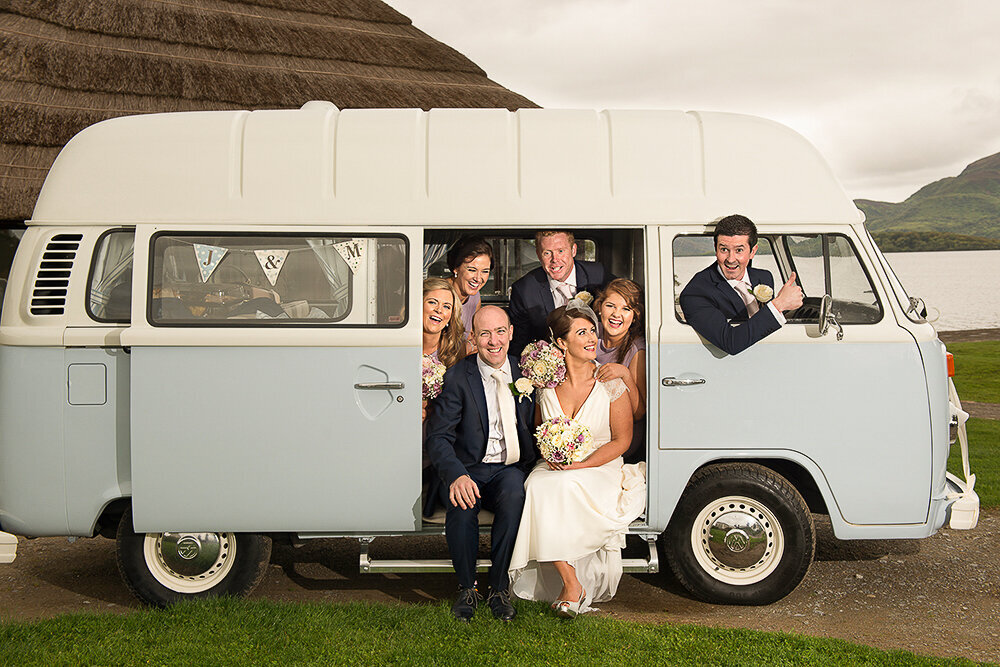 bridal party sitting in the back of a vintage Volkswagen camper van at the Europe Hotel, Killarney