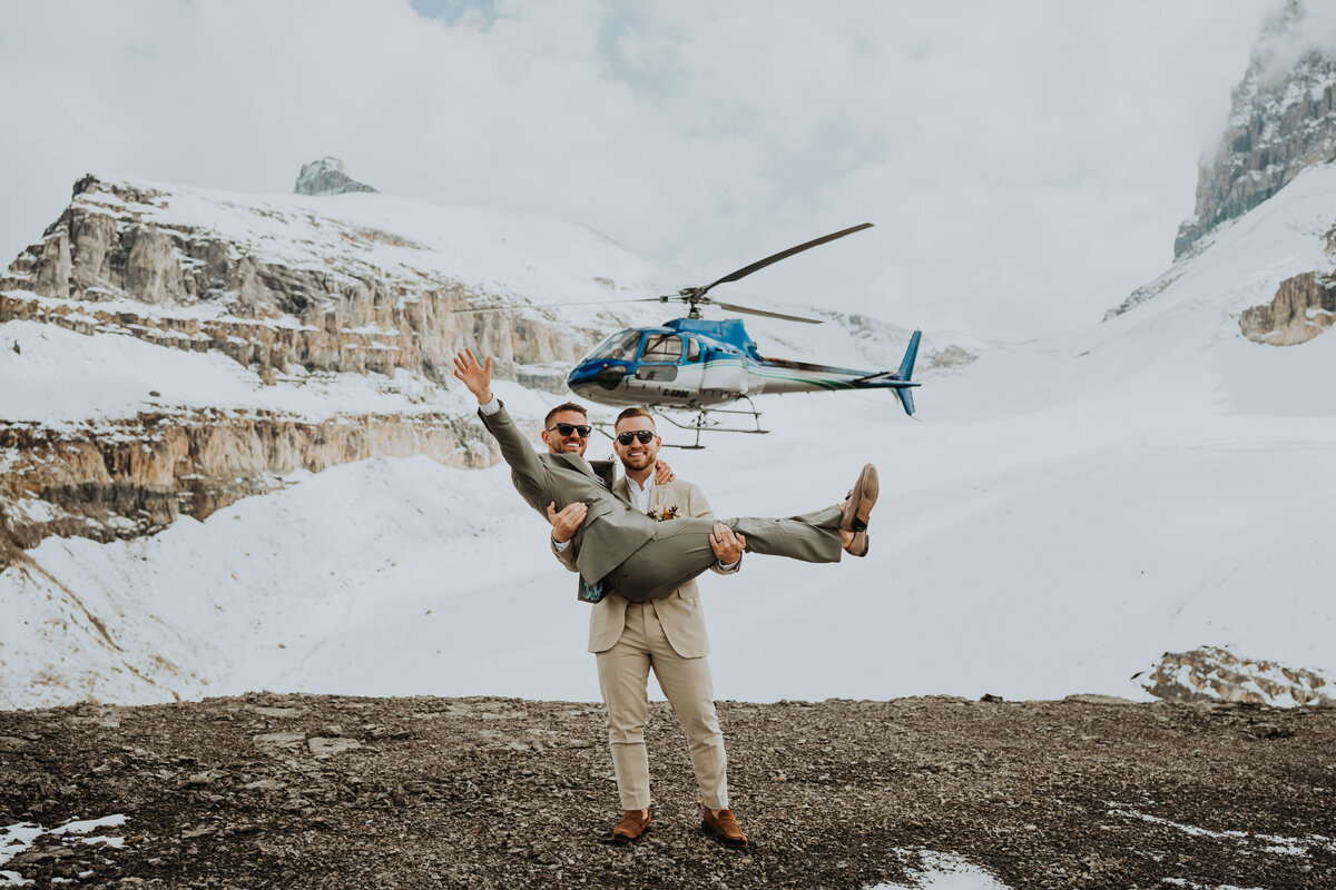 Eloping couple on top of a mountain at Rockies Heli Alberta