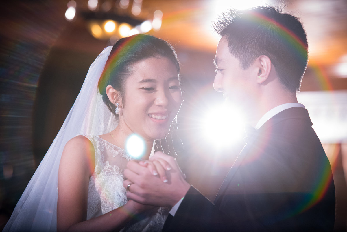 first dance with rainbow lens flare