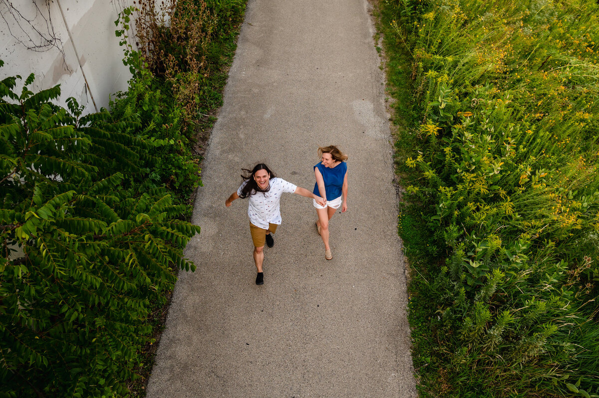 A couple walks down a path in Milwaukee, WI
