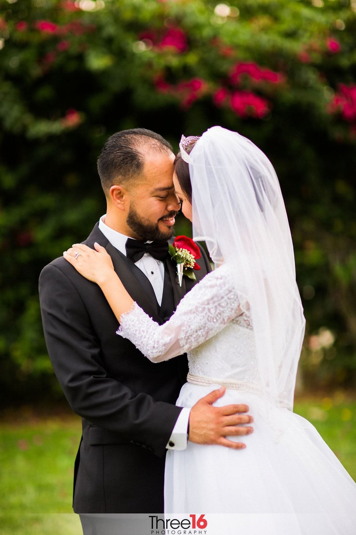 Sweet moment between Bride and Groom with foreheads touching and hands on each other