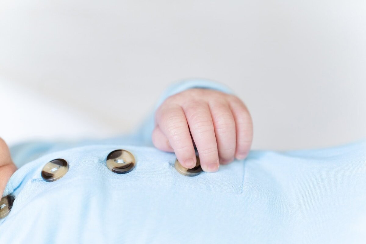 baby's hand during Gainesville, Virginia lifestyle newborn pictures