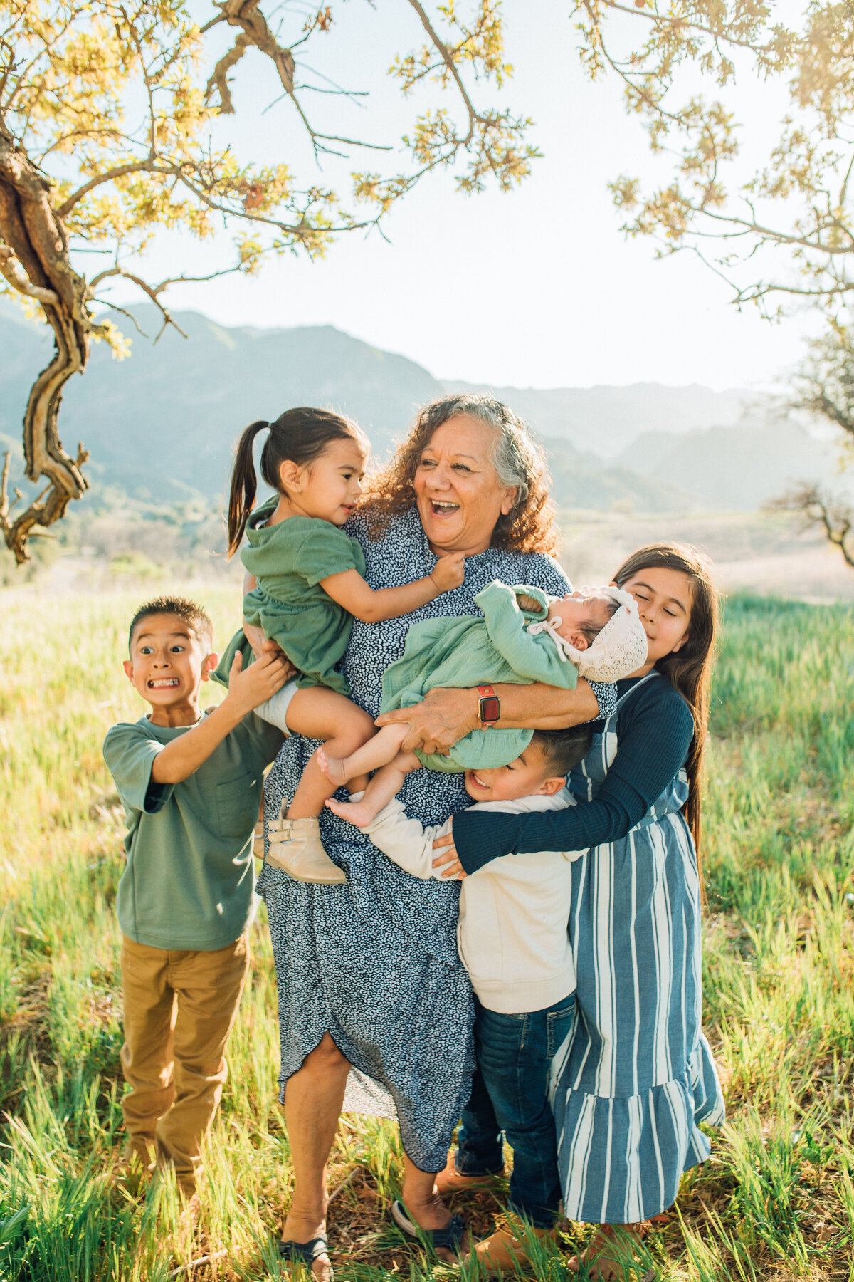 Family Portrait Photo Of Kids Hugging An Older Woman Los Angeles