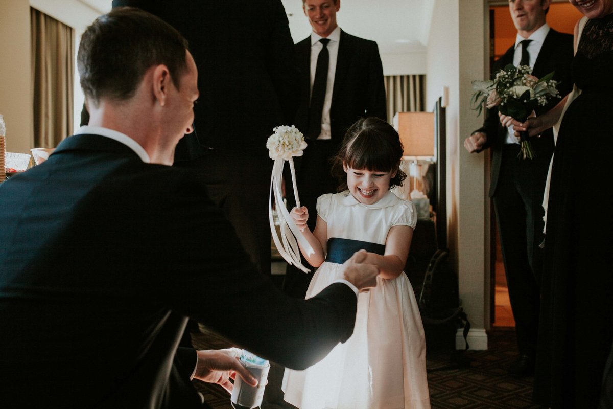 Groom hold flower girls hand at Scottish Rite wedding