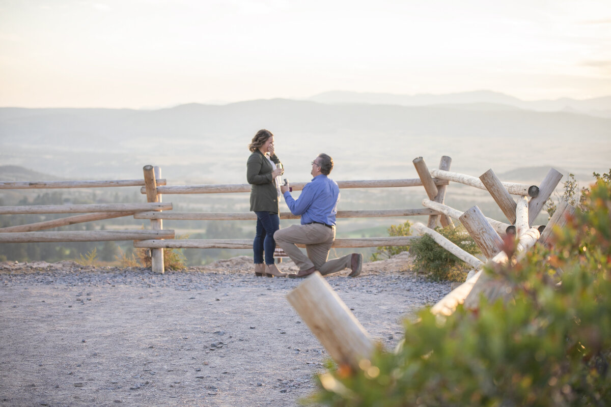 Surprise Proposal at Daniel's Park near castle rock Colorado in olive jacket