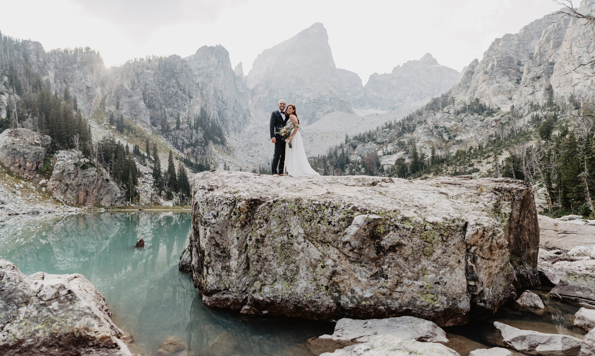 Jackson hole photographers capture couple touching foreheads after intimate elopement
