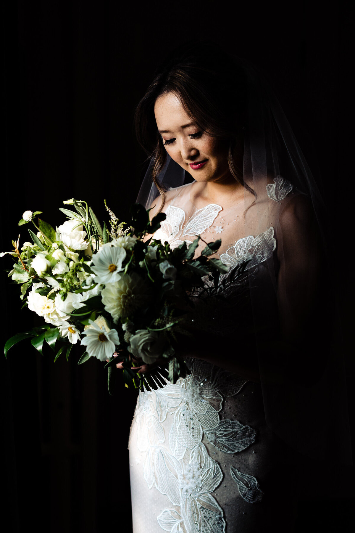 One of the top wedding photos of 2021. Taken by Adore Wedding Photography- Toledo, Ohio Wedding Photographers. This photo is of a bride taking a moment before her wedding