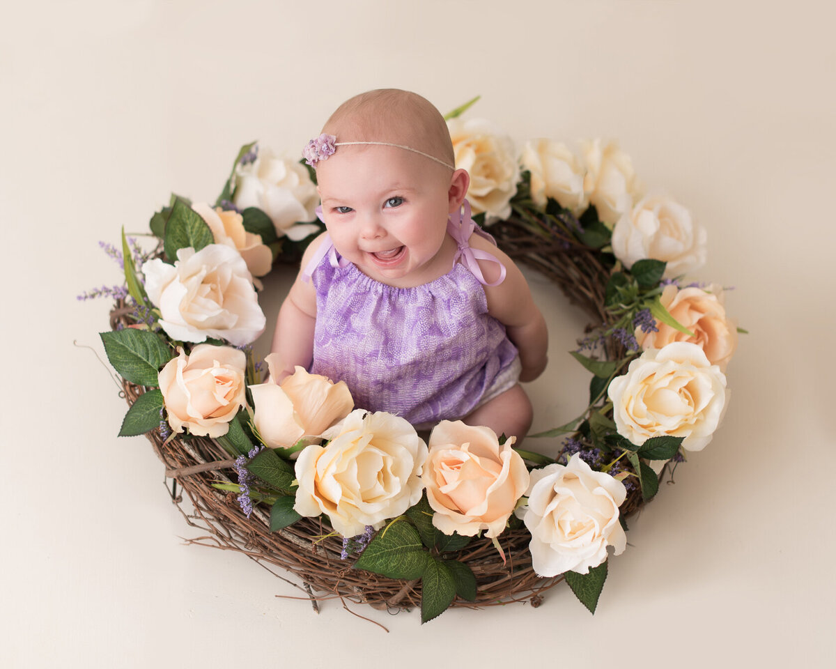 Cute little baby in yellow roses bucket portrait in Houston